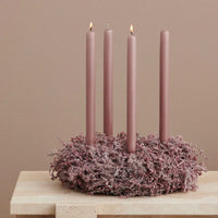 soft rose cylindrical candles on xmas wreath styling